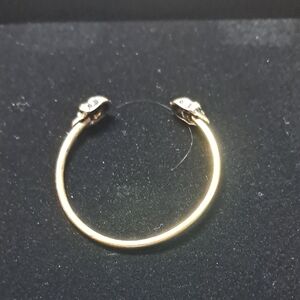 Elegant Gold Tone Bracelet with Skull Accents